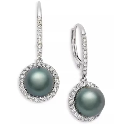 Silver drop earrings featuring round, dark pearls surrounded by a halo of small white stones, with lever-back clasps for secure wear.