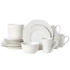 A 16-piece Pfaltzgraff Dinnerware Set featuring a white ceramic design with intricate embossed patterns, including four each of dinner plates, salad plates, bowls, and mugs.