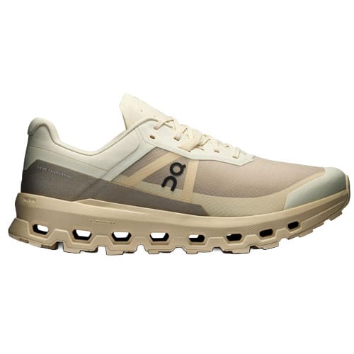 A beige and cream athletic shoe with a unique sole design featuring multiple open segments. The shoe displays a logo on the side and has lace-up fastening.