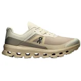 A beige and cream athletic shoe with a unique sole design featuring multiple open segments. The shoe displays a logo on the side and has lace-up fastening.