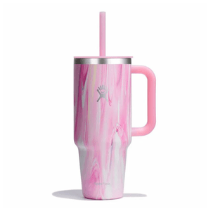 A pink and white marbled tumbler with a handle and a straw, featuring a silver logo.