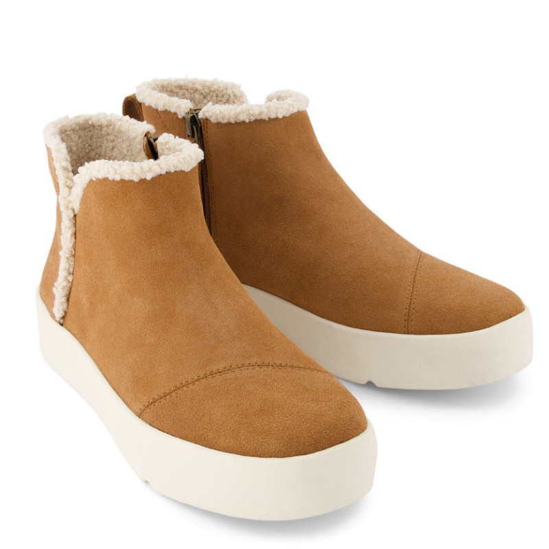 TOMS Verona Mid Platform Sneaker features a tan suede upper with a plush shearling lining, side zipper, and a white platform sole.