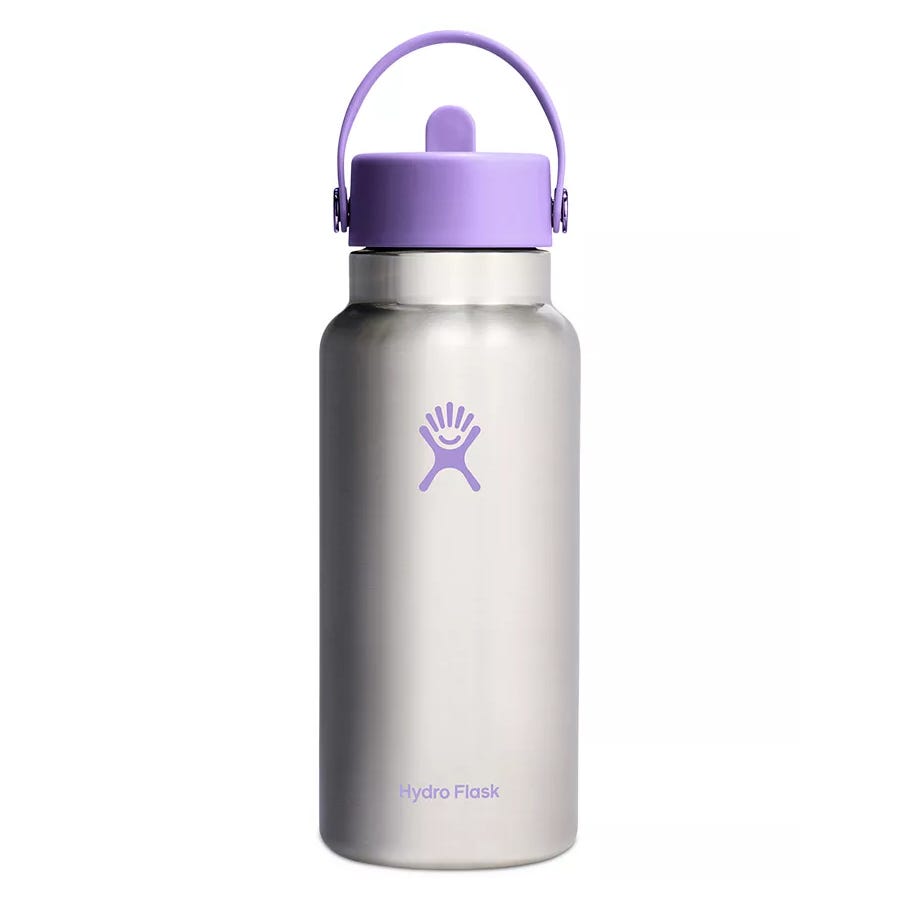 Stainless steel water bottle with a wide mouth, featuring a lavender-colored lid and logo. Designed for insulation and temperature retention.