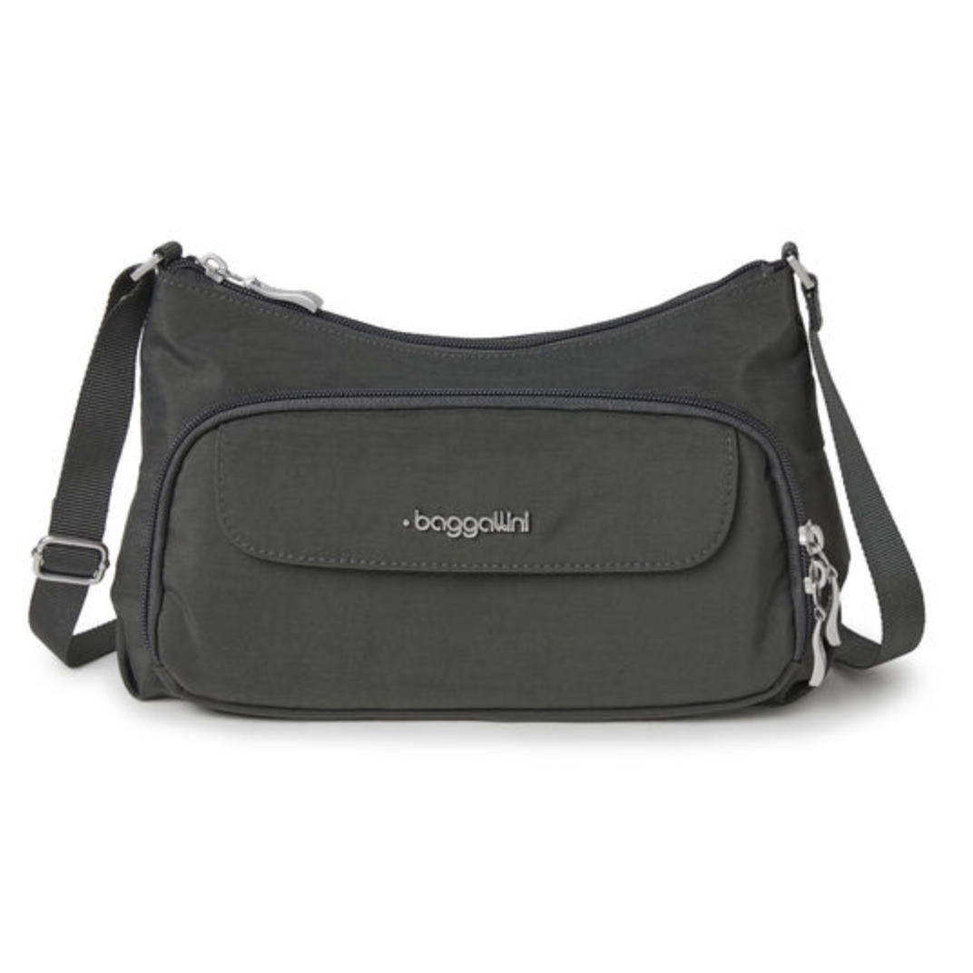 Black crossbody bag with adjustable strap and multiple zipper compartments.