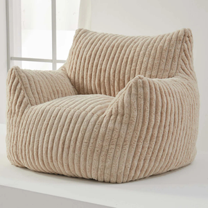 A beige, ribbed corduroy bean bag chair with armrests and backrest, designed for comfort and casual seating.