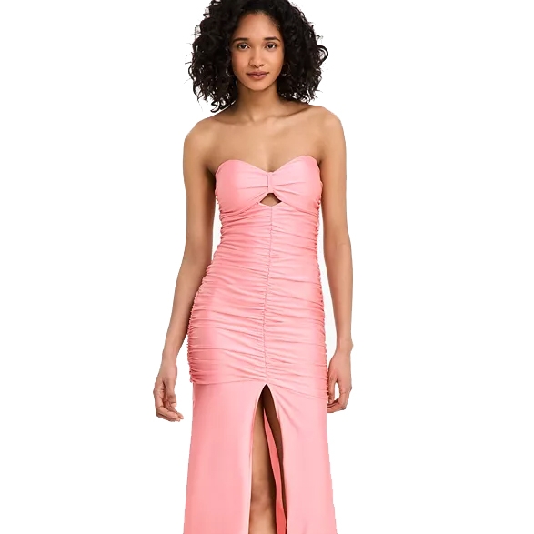 A pink strapless dress features a ruched design with a front cut-out and a thigh-high slit.