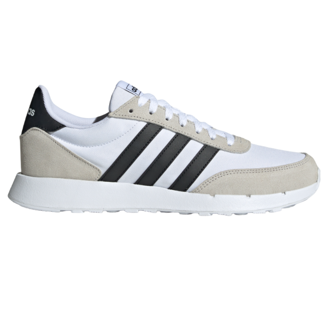 White and beige Adidas sneaker with black stripes on the side.