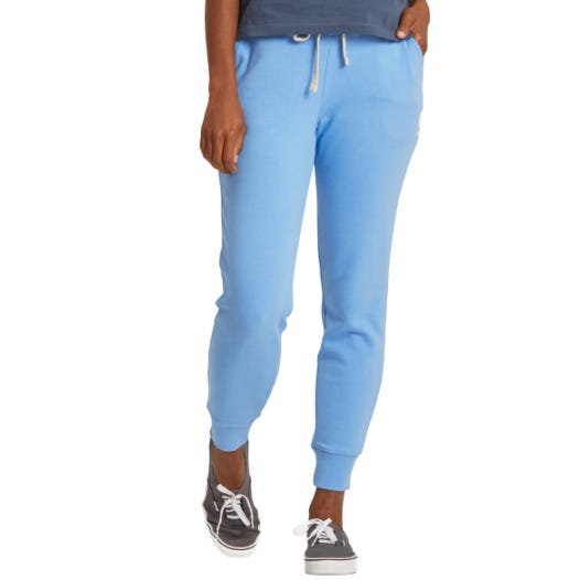 Light blue jogger pants with a drawstring waist and ribbed cuffs, paired with gray lace-up sneakers.