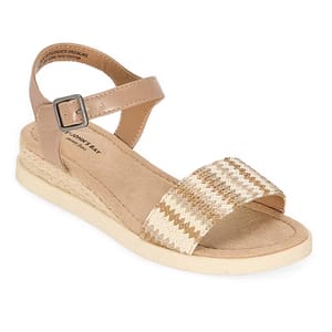 A tan wedge sandal with an ankle strap, a metallic buckle, and a woven zigzag pattern on the front strap.