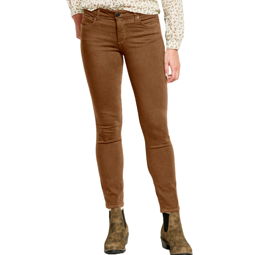 Brown skinny jeans with a classic five-pocket style, belt loops, and a button-zip closure, paired with brown ankle boots.