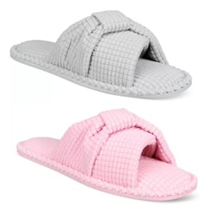 Two pairs of textured slippers, one in gray and one in pink, each featuring a knotted strap design over the foot.