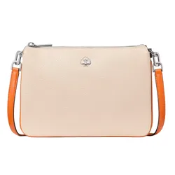 A beige leather crossbody bag with a silver spade logo and orange strap accents.