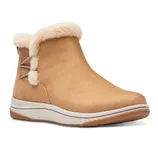 Tan ankle boot with faux fur trim, featuring a cushioned sole and side lace design, suitable for cold weather.