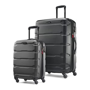 Two black, hard-shell Samsonite Omni spinner suitcases, one larger and one carry-on size, with multi-directional wheels and retractable handles.