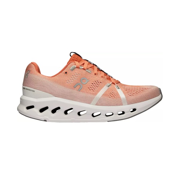Peach-colored running shoe with a breathable mesh upper, featuring On's logo on the side. It has a distinctive white and black sole with perforations for cushioning and support.