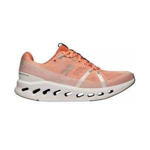 Peach-colored running shoe with a breathable mesh upper, featuring On's logo on the side. It has a distinctive white and black sole with perforations for cushioning and support.