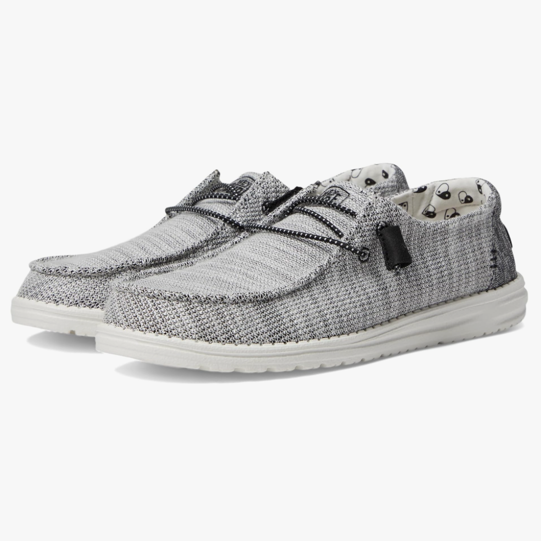 Casual knit sneakers with a lace-up design and white soles.