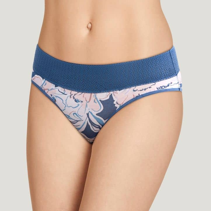 A pair of blue and pink floral patterned panties on a mannequin.