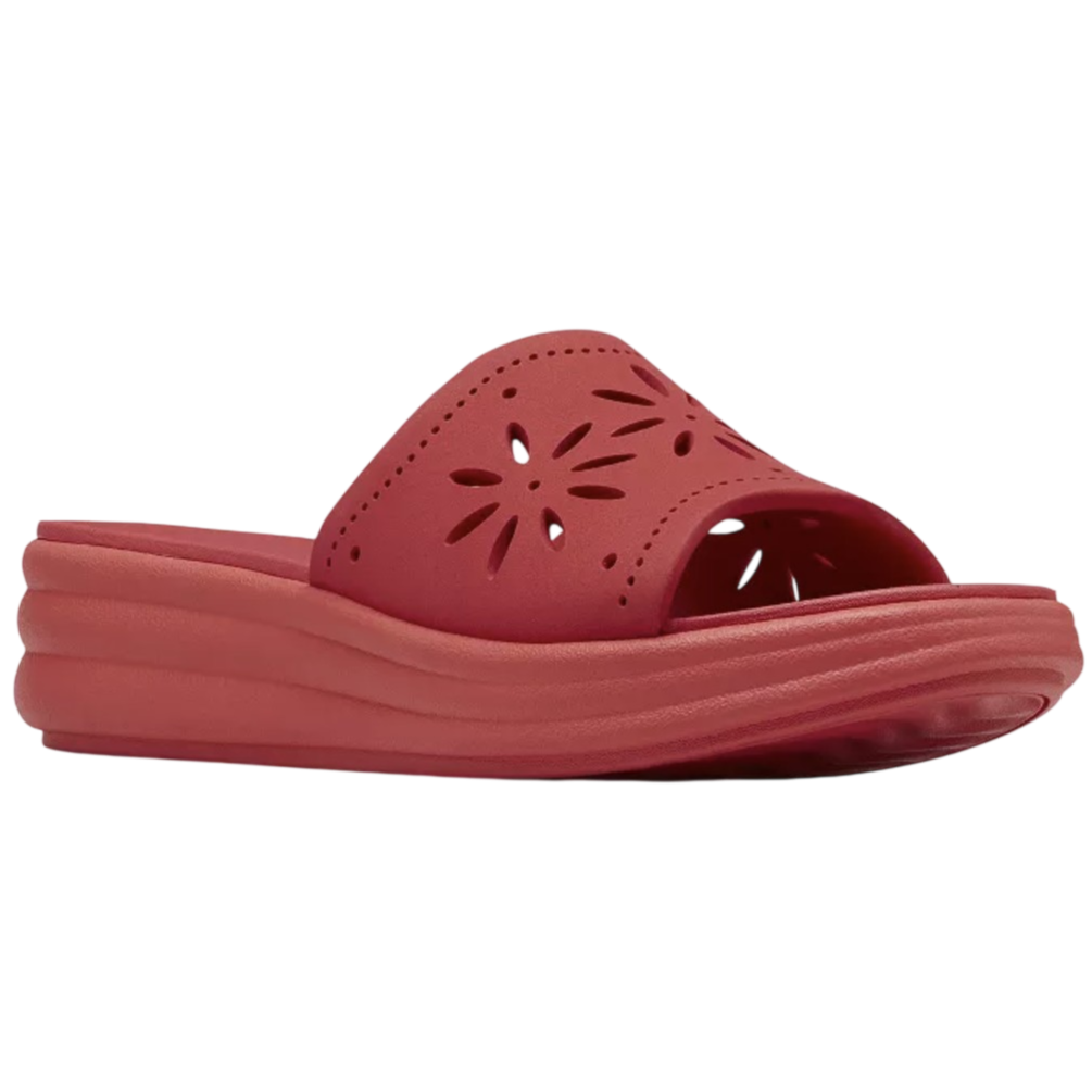 A red slide sandal with a thick sole and perforated flower-like design on the upper.