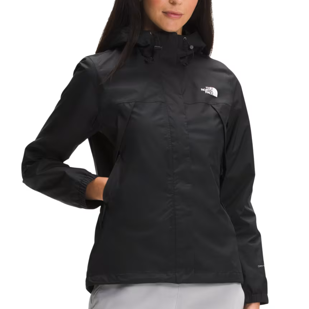 The North Face Antora Jacket is a black, waterproof, windproof shell with a hood, featuring the brand's logo on the chest. It includes elastic cuffs and side pockets, designed for protection against harsh weather conditions.