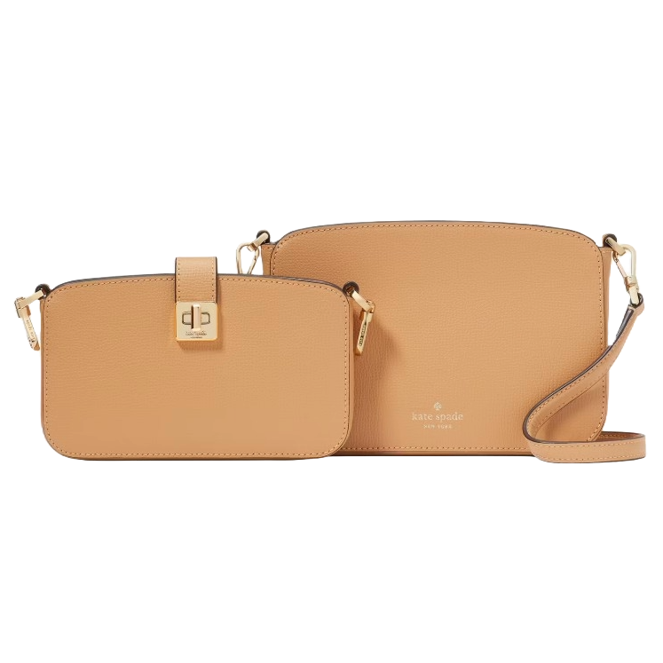 The Kate Spade Leather Crossbody Duo consists of two tan crossbody bags with gold-tone hardware. One bag features a turn-lock closure, while the other has a zip closure, both with detachable straps for versatile styling.