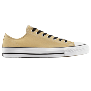 A low-top sneaker with a beige canvas upper, white rubber sole, and black laces, featuring a classic design with a white toe cap and black stripe detailing.