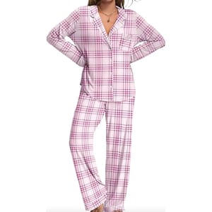 Women's pink and white plaid pajamas with a long-sleeve button-up top featuring a chest pocket, and matching pants.