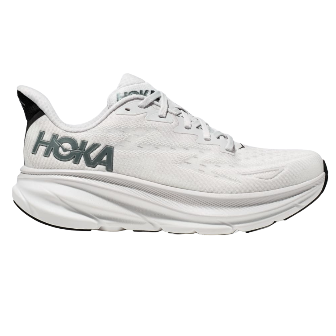 Hoka Men's Clifton 9 Running Shoes feature a sleek, white design with a large HOKA logo on the side, cushioned sole, and breathable mesh upper for comfort and support during runs.