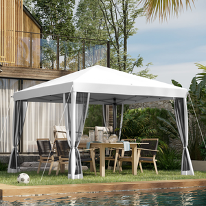 Outdoor gazebo with a white canopy and mesh curtains, set up next to a pool. It features a wooden dining table and chairs underneath, with trees and modern architecture in the background.