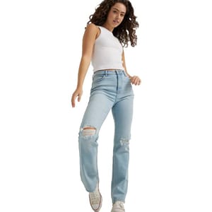 High-rise, light blue Wrangler jeans with a straight leg, distressed detailing on the knees, worn with a white tank top and white sneakers.