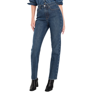 High-waisted blue jeans with side button embellishments, paired with black ankle boots.