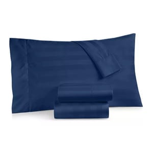 Navy blue bed sheet set with a subtle striped pattern, including pillowcases and folded sheets against a white background.