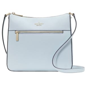 A pale blue Kate Spade large crossbody bag with a pebbled texture, featuring a front zipper pocket, gold-tone hardware, a slim adjustable strap, and the Kate Spade logo embossed at the top center.