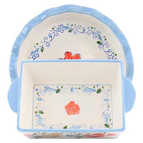Two decorative ceramic baking dishes are shown, one rectangular and the other round, both with floral patterns and blue trim.