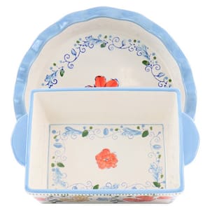 Two decorative ceramic baking dishes are shown, one rectangular and the other round, both with floral patterns and blue trim.