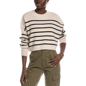 A beige cropped pullover with black horizontal stripes, featuring a ribbed crew neckline and cuffs, paired with olive cargo pants.