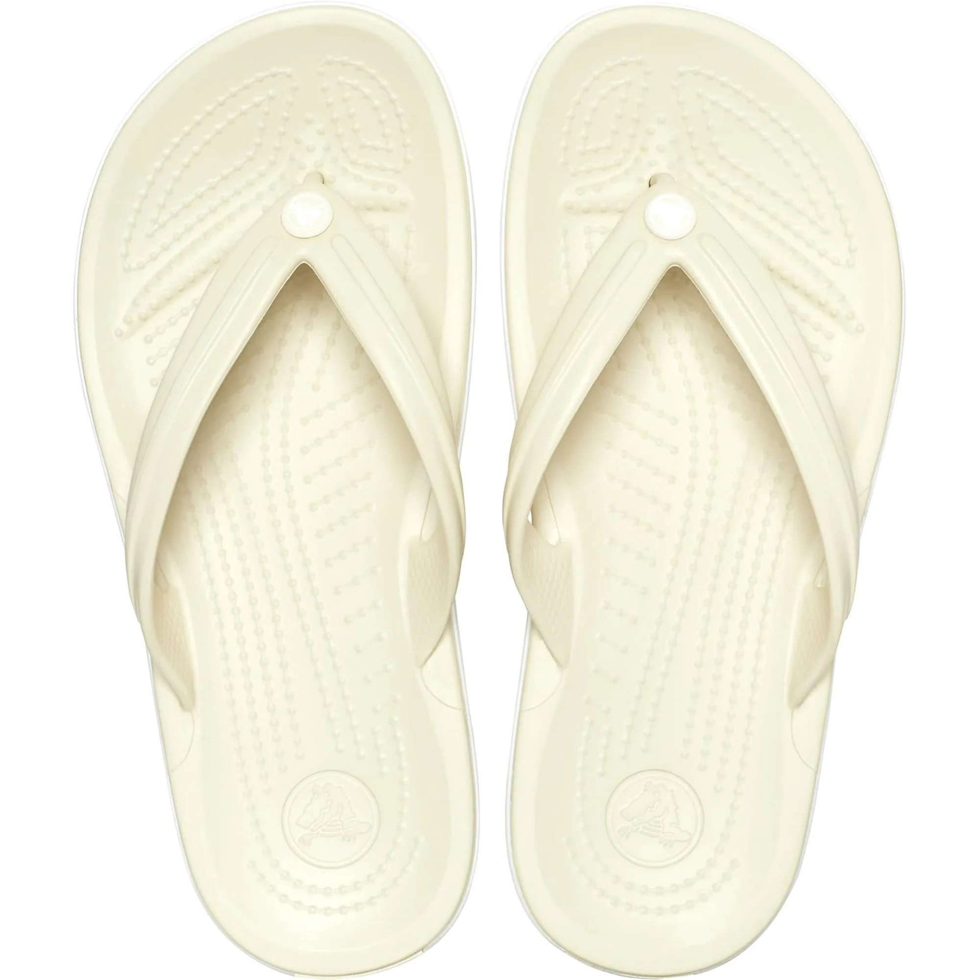 A pair of light-colored flip-flops with textured soles and a thong-style upper.