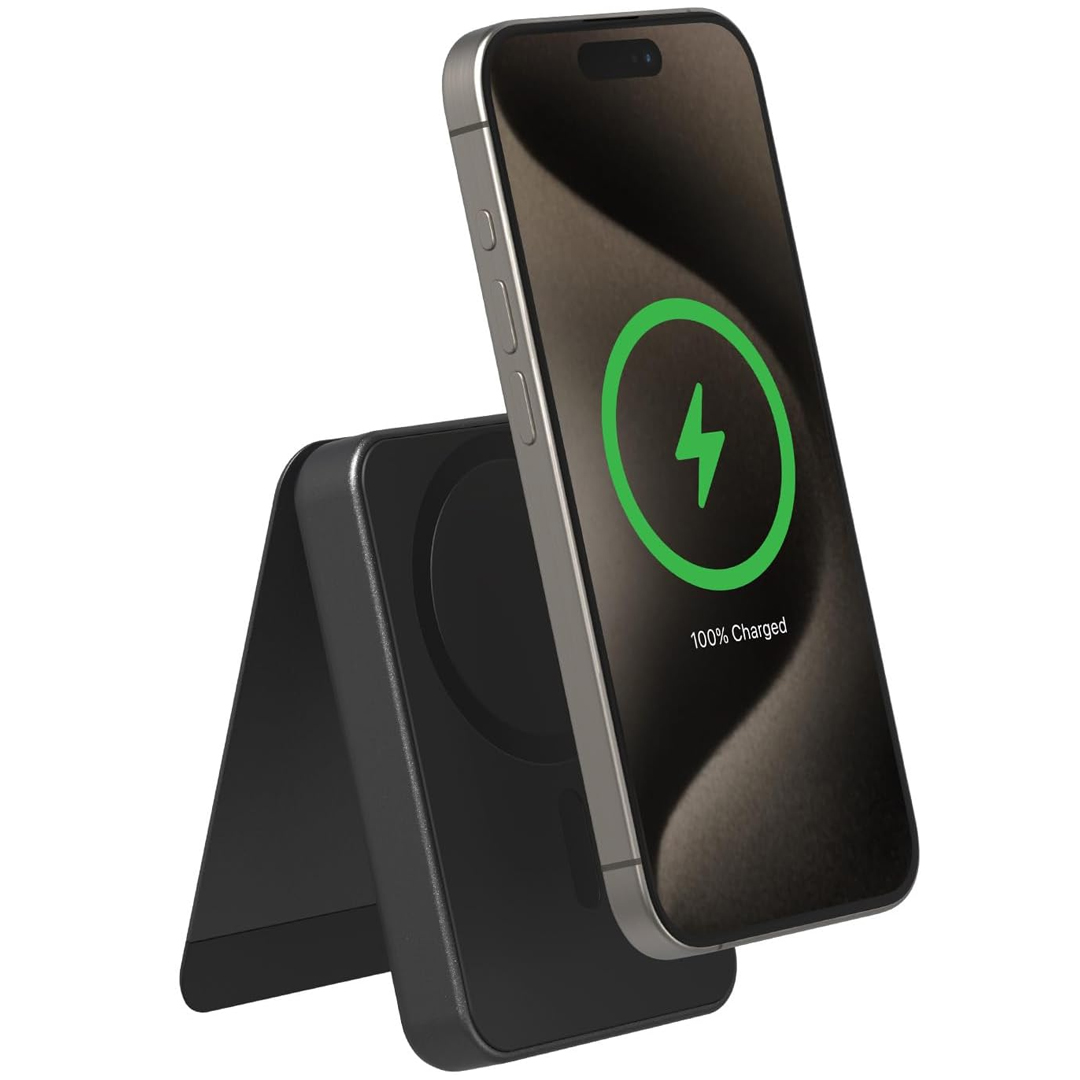The Mophie Wireless Charger is a sleek, black stand designed to charge smartphones wirelessly. It holds the phone upright and indicates a full charge with a green circle and lightning bolt symbol on the screen.
