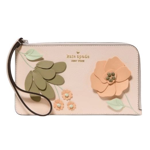 A Kate Spade wristlet featuring a floral design with green leaves and peach flowers on a light pink background.
