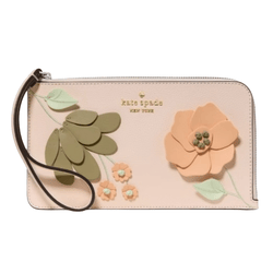 A Kate Spade wristlet featuring a floral design with green leaves and peach flowers on a light pink background.