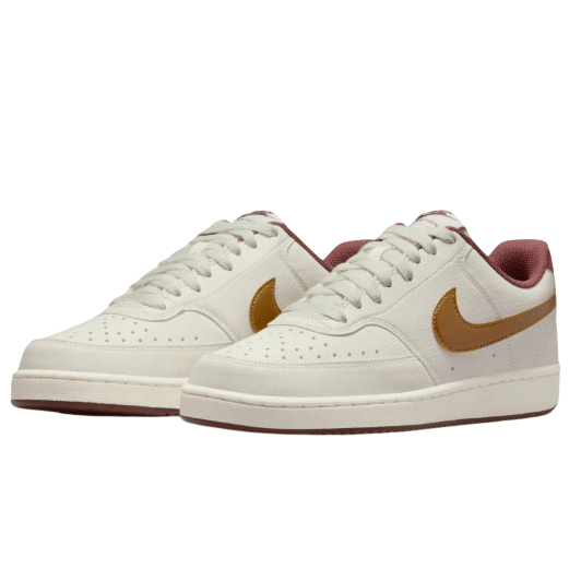 A pair of low-top white sneakers with a brown swoosh and maroon lining, featuring perforated toe caps and white laces.