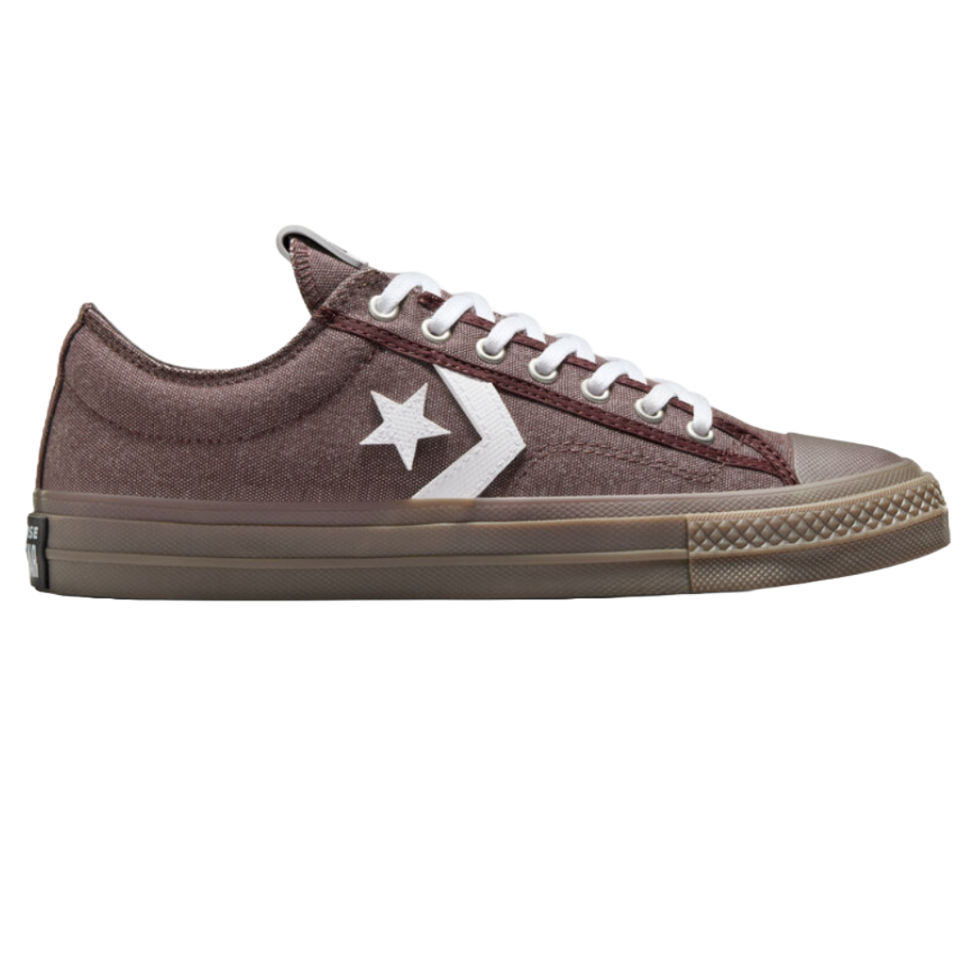 The Converse Star Player 76 Shoes are low-top sneakers with a brown canvas upper, white laces, and distinctive white chevron and star branding on the side. They feature a rubber toe cap and brown rubber sole.