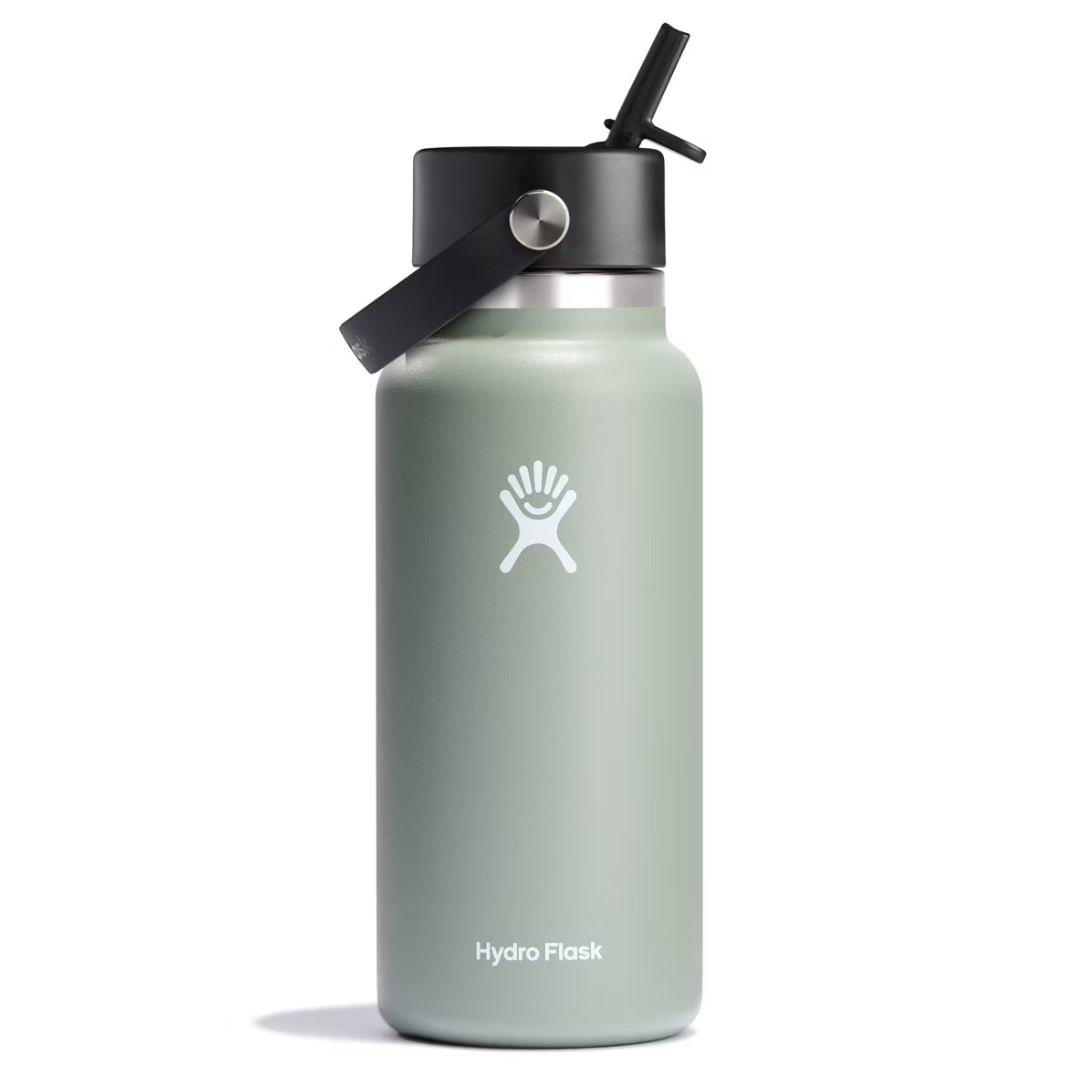 A light green Hydro Flask bottle featuring a black cap with a built-in straw and a carrying handle.