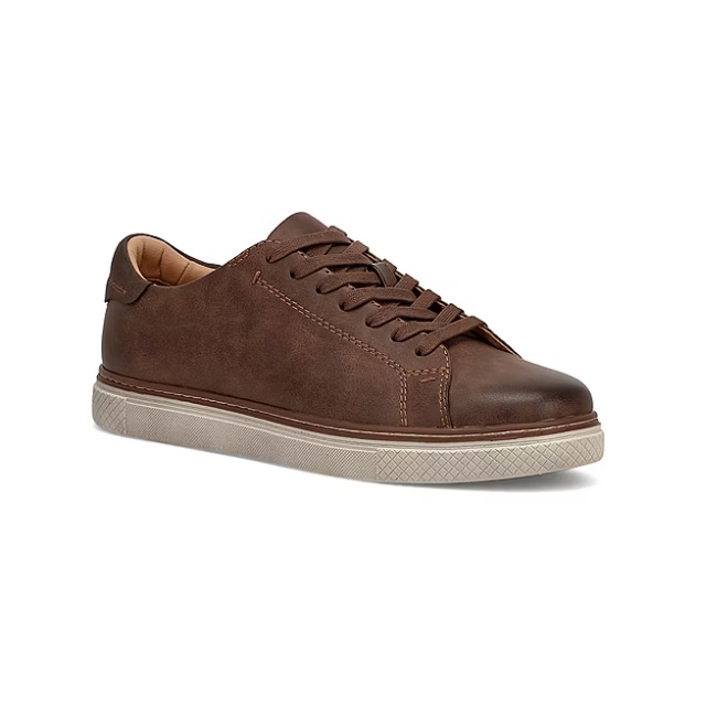 Brown leather sneaker with matching laces, featuring a white textured rubber sole.