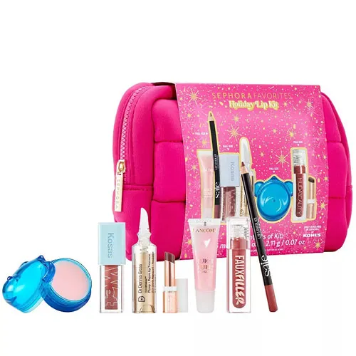 Sephora Favorites Holiday Lip Kit includes a variety of lip products and a bright pink bag. The kit features lip gloss, lip balm, lipstick, and a lip pencil, showcasing brands like Pat McGrath Labs, NARS, and KOSAS.