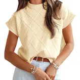 Sleeveless diamond-patterned yellow sweater with round neck, paired with a light blue skirt and accessorized with a brown belt and bracelets.