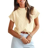 Sleeveless diamond-patterned yellow sweater with round neck, paired with a light blue skirt and accessorized with a brown belt and bracelets.