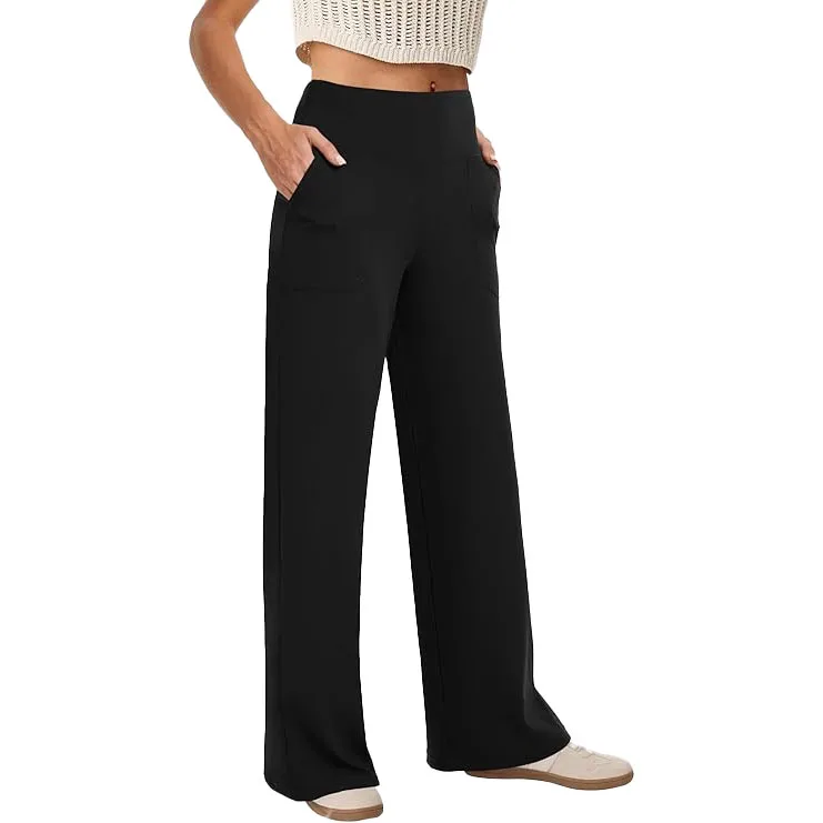 Black high-waisted, wide-leg yoga pants with front pockets and a relaxed fit. Paired with white sneakers and a textured, cropped top.