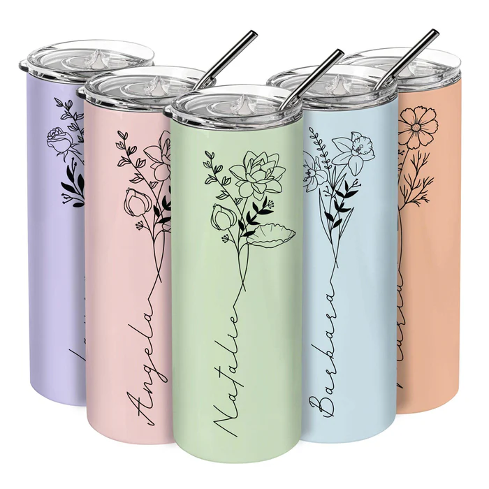 Five pastel-colored tumblers with floral designs and personalized names in script. Each tumbler features a metal straw and clear lid.