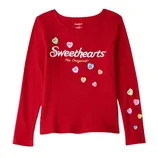 Red long-sleeve shirt featuring the \“Sweethearts The Original\“ logo with decorative candy heart designs scattered across the front and sleeve.